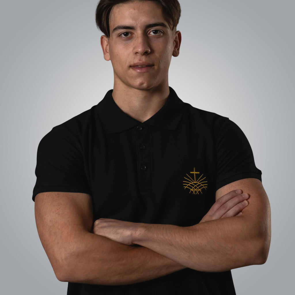 Close view of black polo shirt with gold Loom in Light logo embroidery
