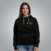 Woman wearing black Christian hoodie with gold embroidered Loom in Light emblem on the chest