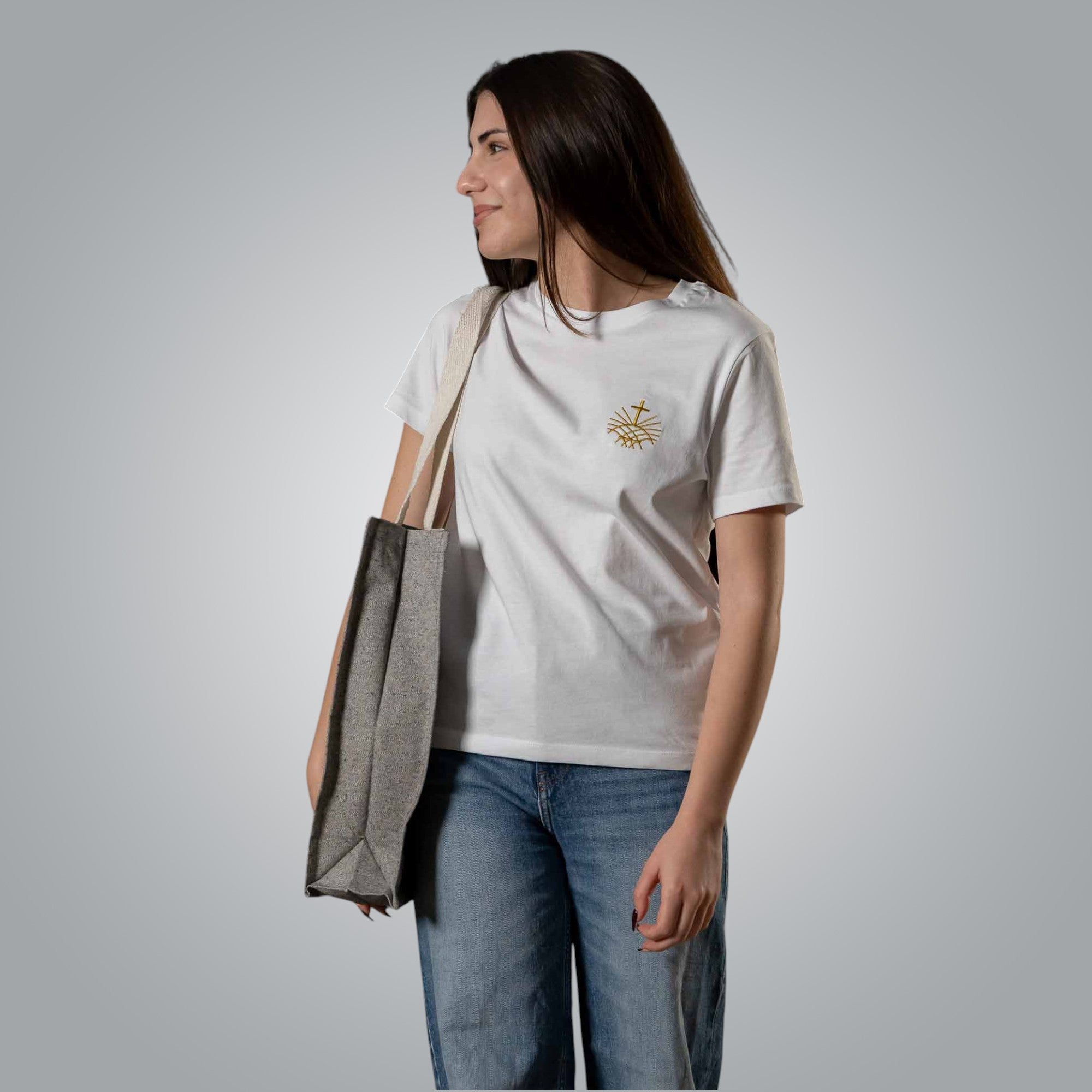 Close-up of grey tote bag with white embroidered Loom in Light logo on shoulder