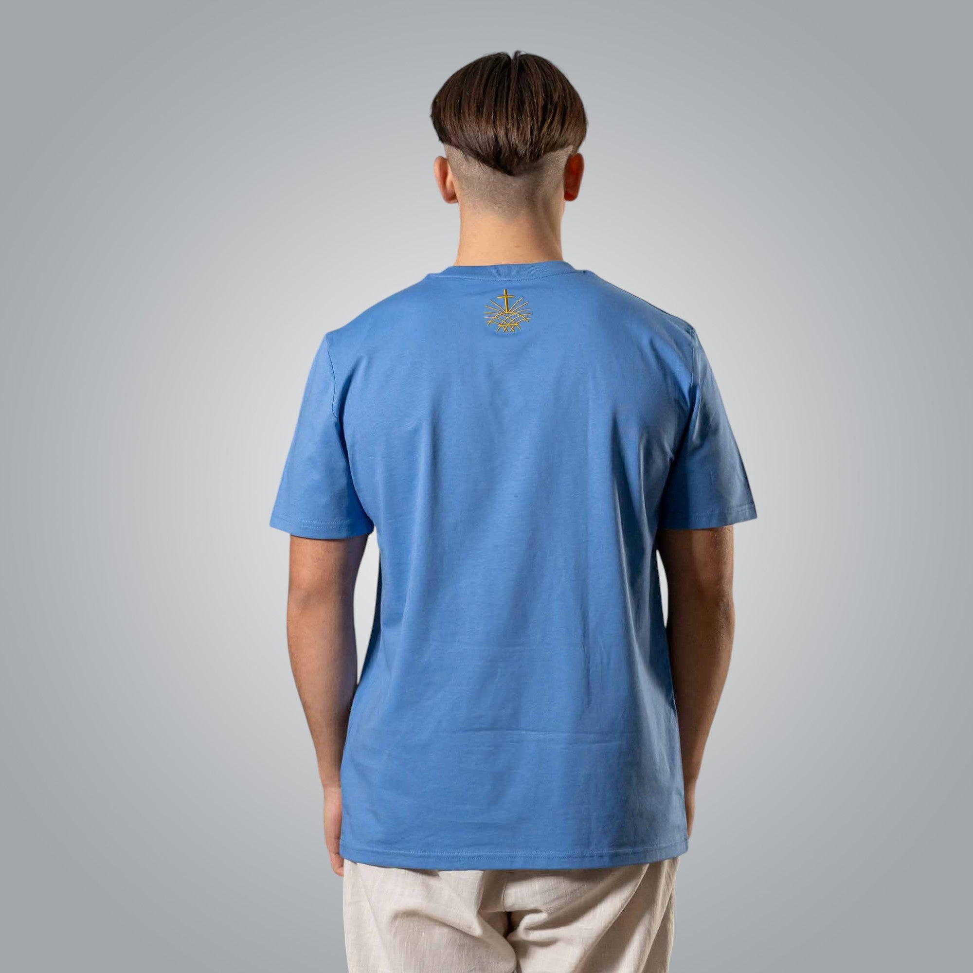 Back view of blue men’s t shirt with gold embroidered Loom in Light logo