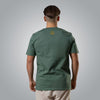 Back view of green men’s t shirt with gold embroidered Loom in Light emblem
