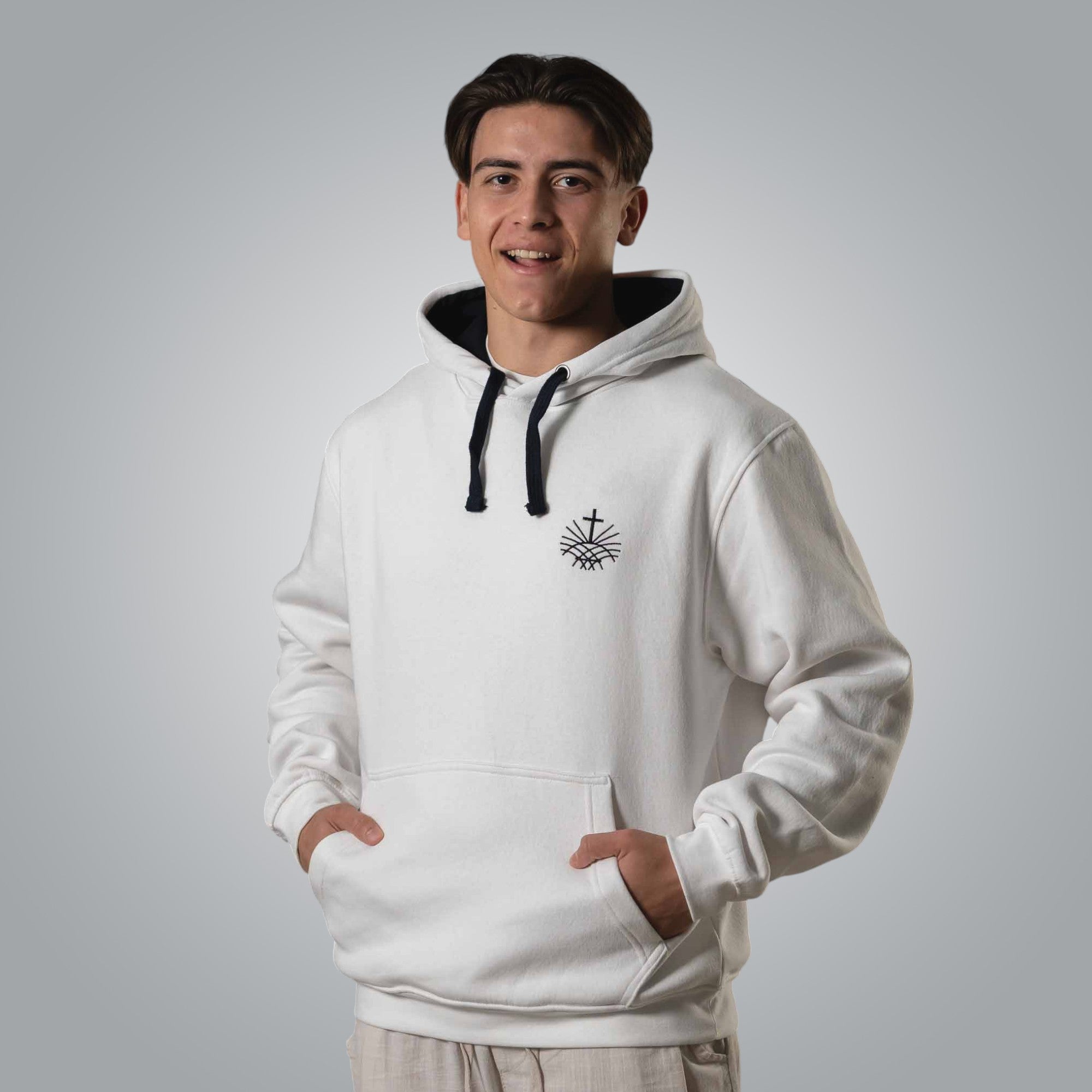 Man wearing white Christian hoodie with black embroidered Loom in Light emblem on the chest