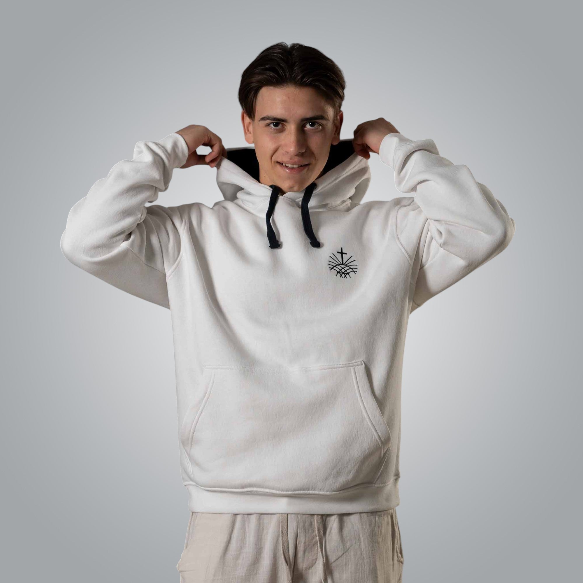 Front view of men’s white hoodie with black embroidered cross emblem