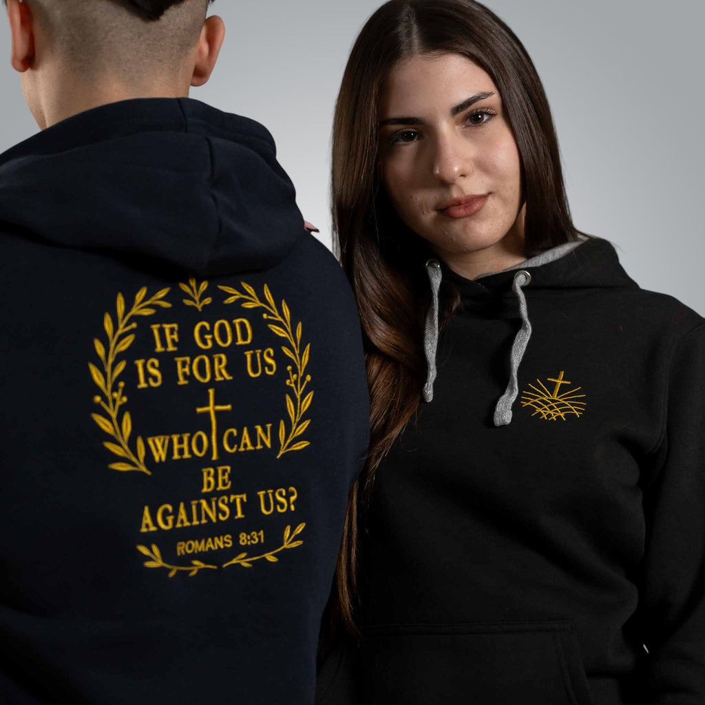 ack view of man and woman wearing black hoodies with gold embroidered Romans 8:31 verse If God is for us who can be against us