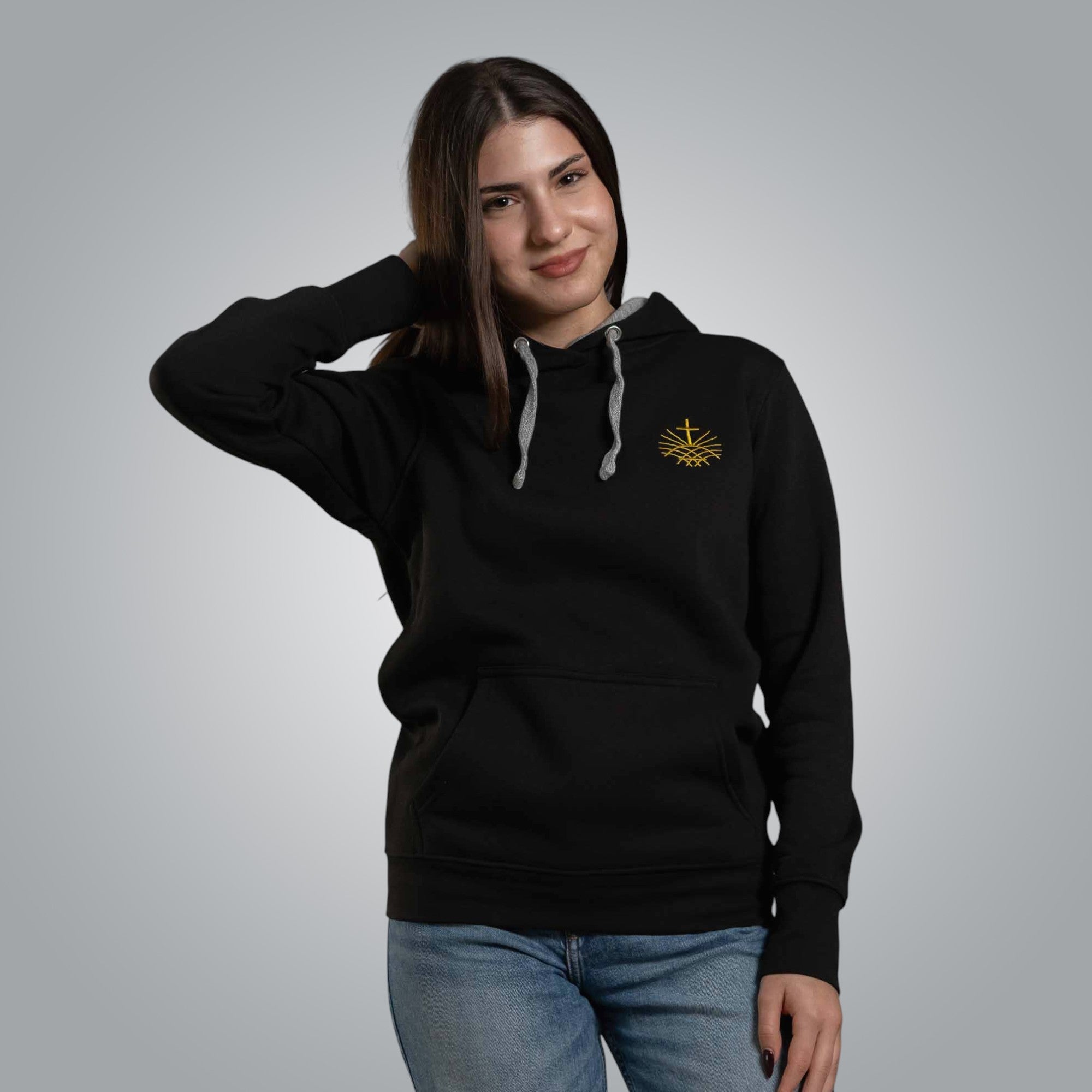 Front view of black women’s Christian hoodie with gold embroidered cross emblem