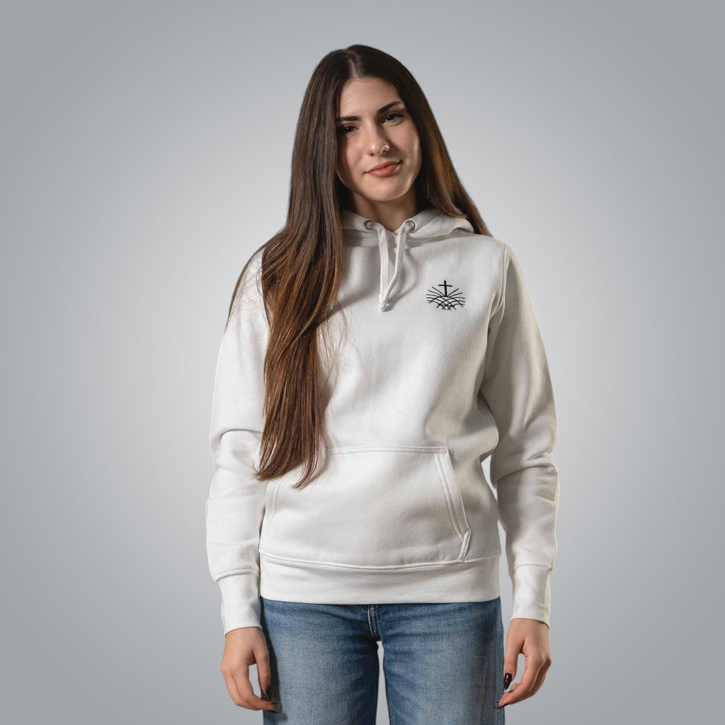 Woman wearing white Christian hoodie with black embroidered Loom in Light emblem on the chest