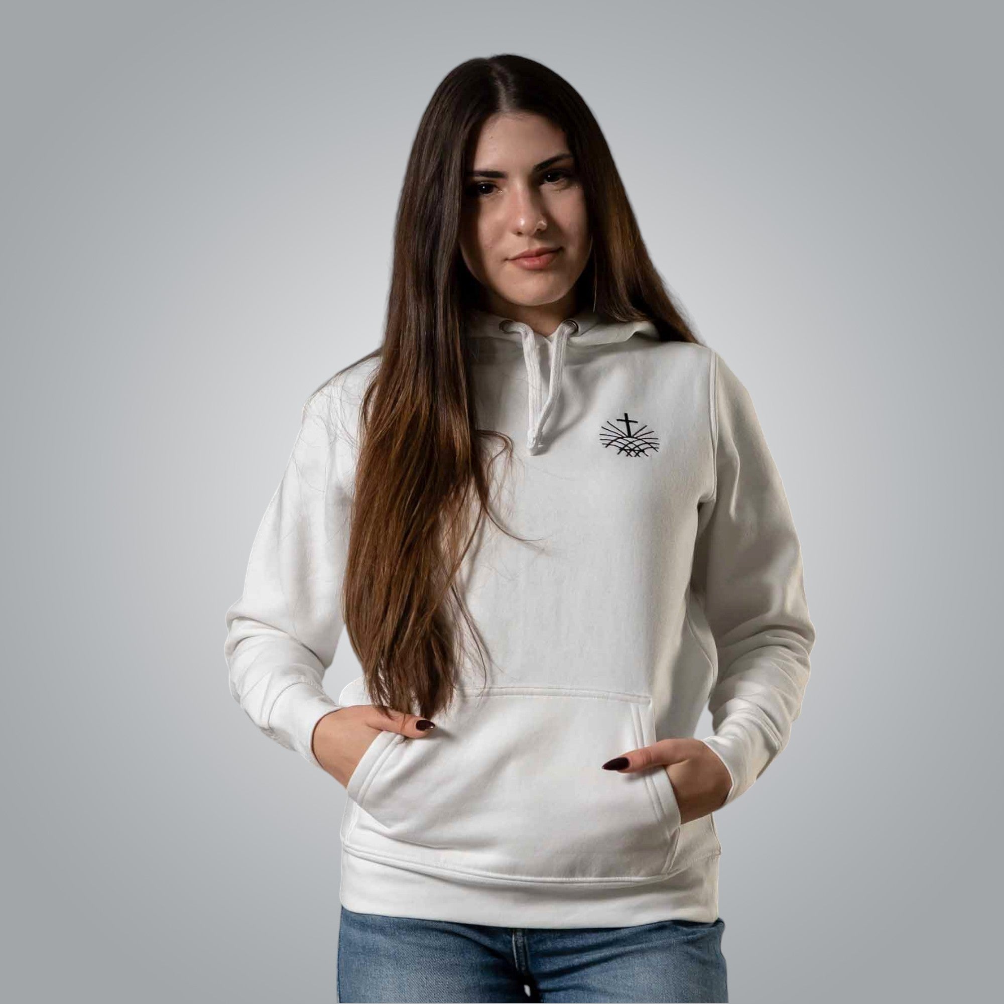 Front view of white women’s hoodie with black embroidered cross emblem