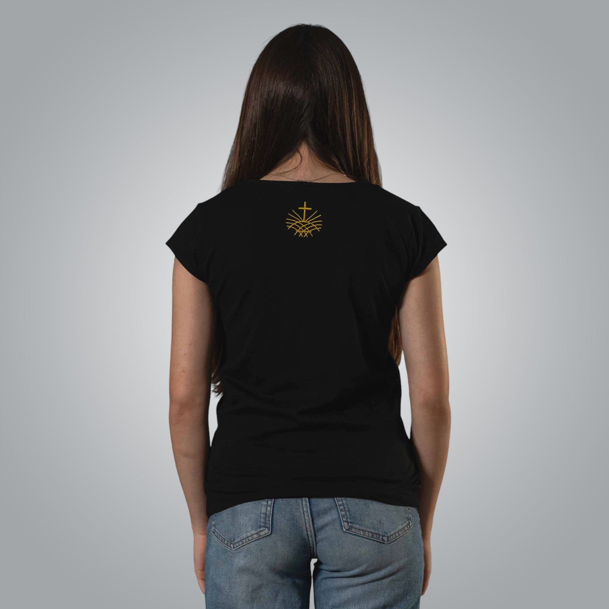 Back view of woman wearing black V neck Christian t shirt with gold embroidered Loom in Light emblem