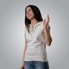 Woman wearing white Christian V neck t shirt with floral and dove embroidery in joyful pose